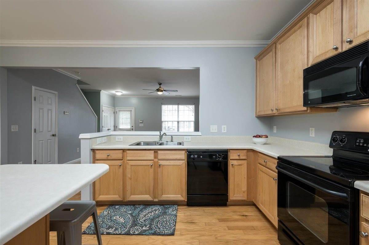 8311 Clasara Circle Raleigh, NC 27613 - Photo 14 of 27 Beautiful kitchen boasts maple cabinets, plenty of counter space, island, and separate pantry. Kitchen