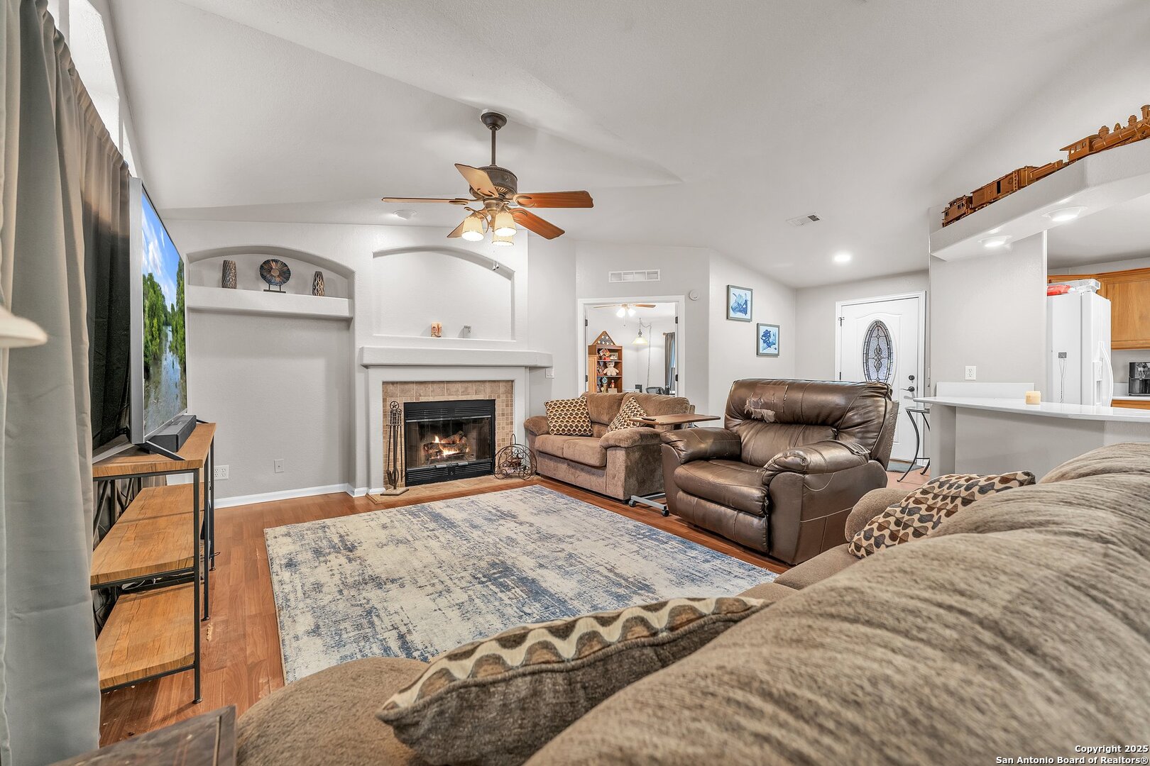 11650 Sunset Ranch Helotes, TX 78023 - Photo 109 of 141 a living room with furniture and a fireplace