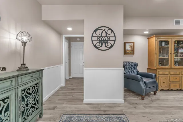 a bathroom with a granite countertop sink mirror and a