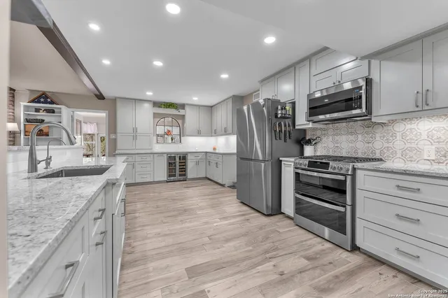 a view of a house with a backyard porch and sitting area