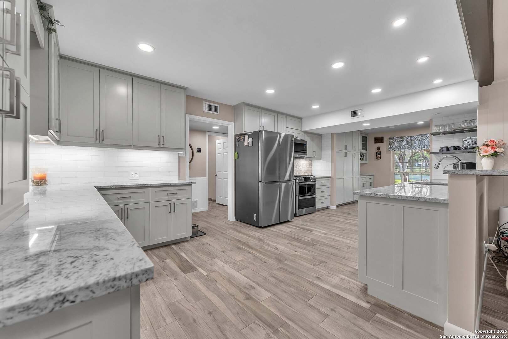 11650 Sunset Ranch Helotes, TX 78023 - Photo 21 of 141 a kitchen with stainless steel appliances granite countertop a refrigerator sink and cabinets
