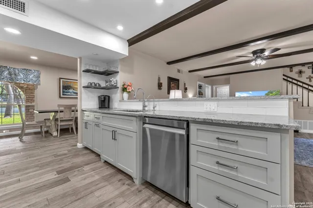 a view of a house with a yard and sitting area