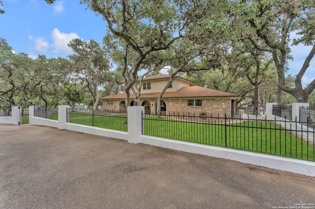 a bench sitting in front of a brick house