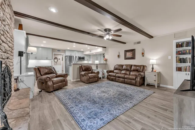 a view of a house with a yard and tree s