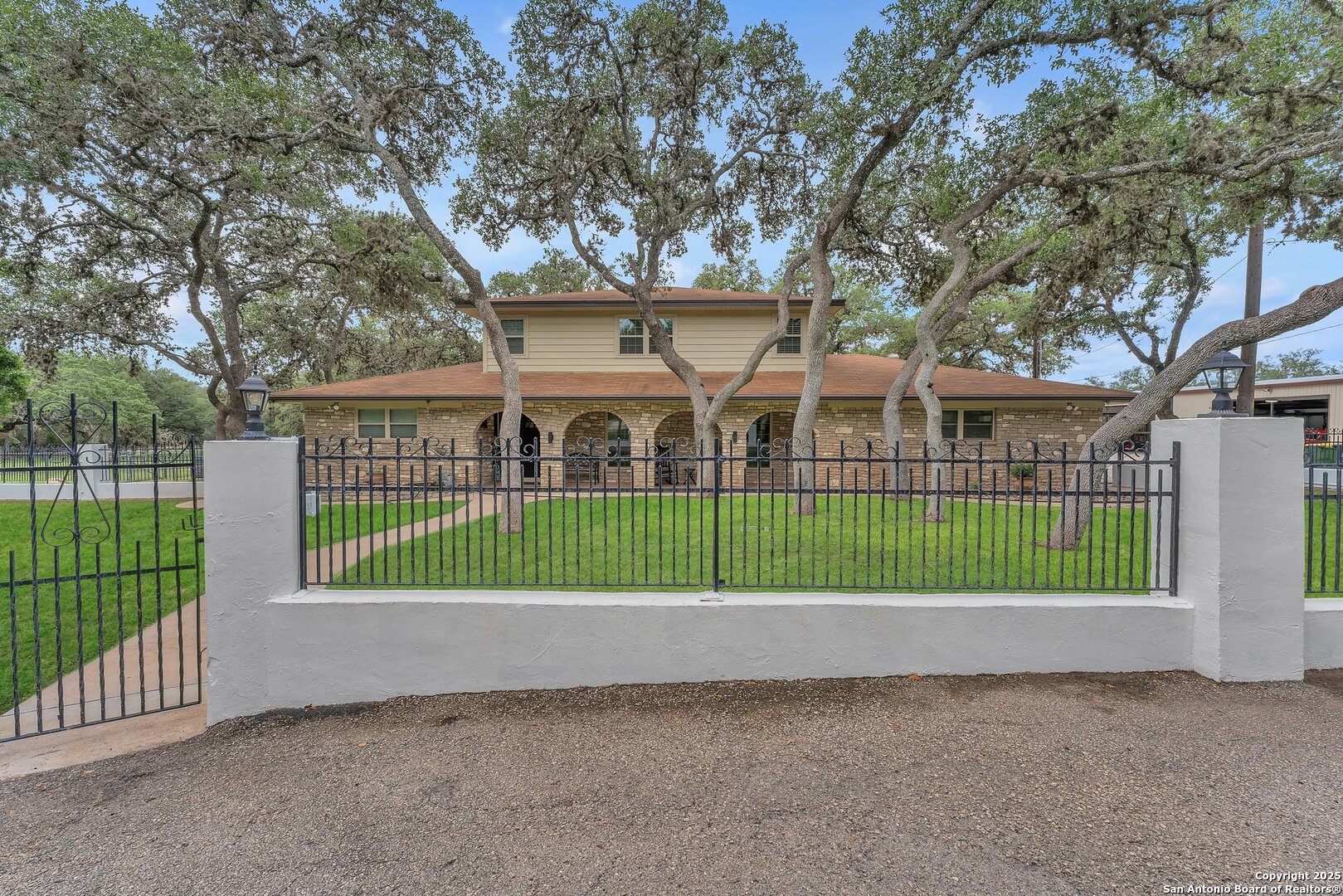 11650 Sunset Ranch Helotes, TX 78023 - Photo 5 of 141 a view of a house with a small yard and plants