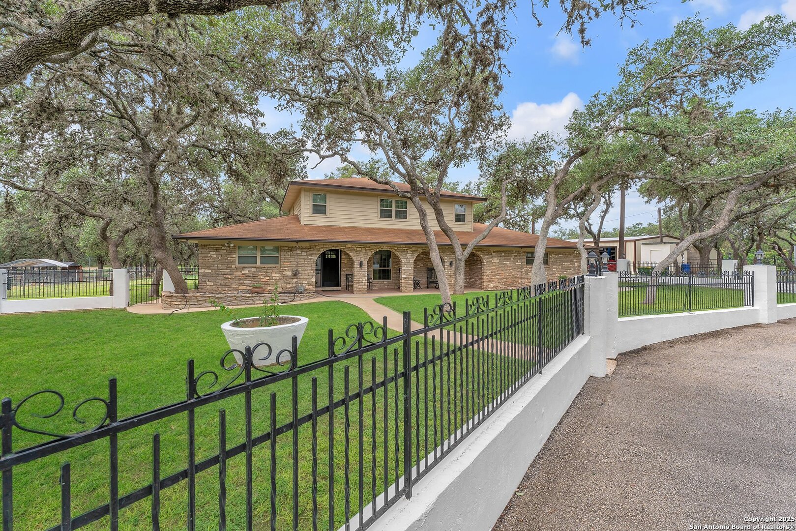 11650 Sunset Ranch Helotes, TX 78023 - Photo 6 of 141 a front view of a house with garden