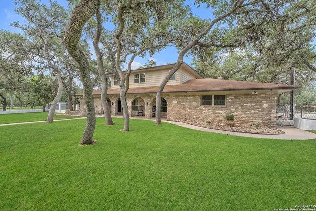 a kitchen with stainless steel appliances granite countertop a refrigerator sink and cabinets