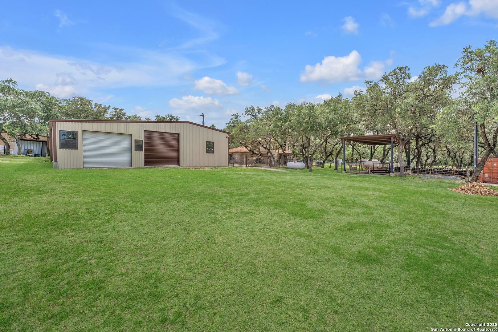 11650 Sunset Ranch Helotes, TX 78023 - Photo 89 of 141 a view of a house with a yard and sitting area