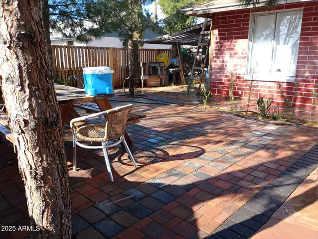 a patio with table and chairs