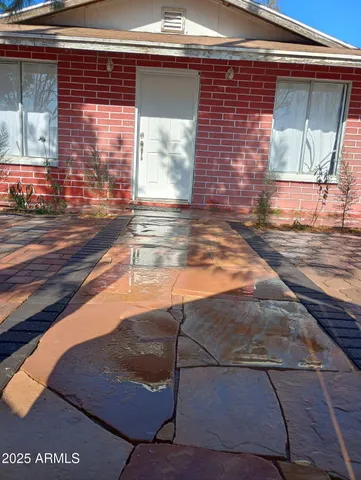 a view of a brick house with a small space