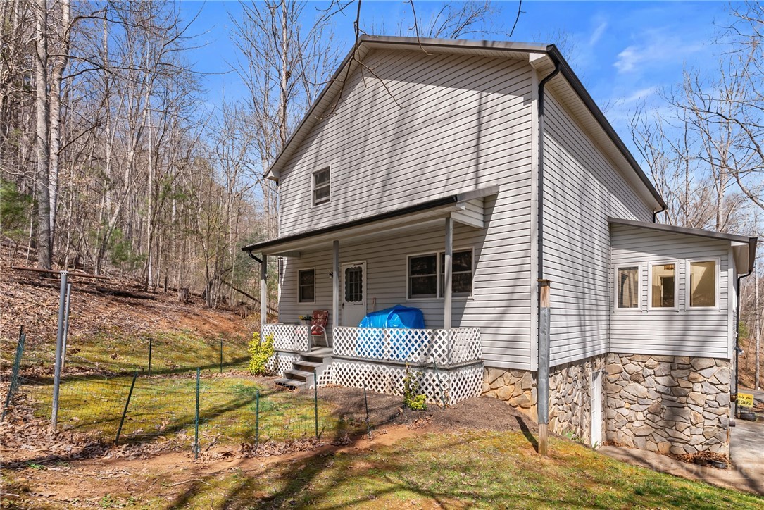 271 Quail Hollow Road Crumpler, NC 28617 - Photo 6 of 30 a view of house with a yard