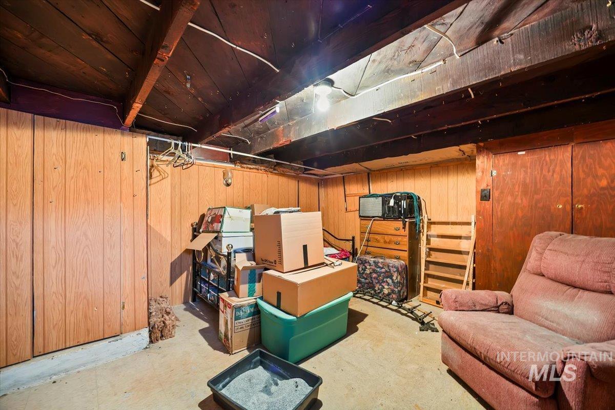 534 Miller Avenue Burley, ID 83318 - Photo 22 of 27 Basement featuring wood walls and tile patterned floors