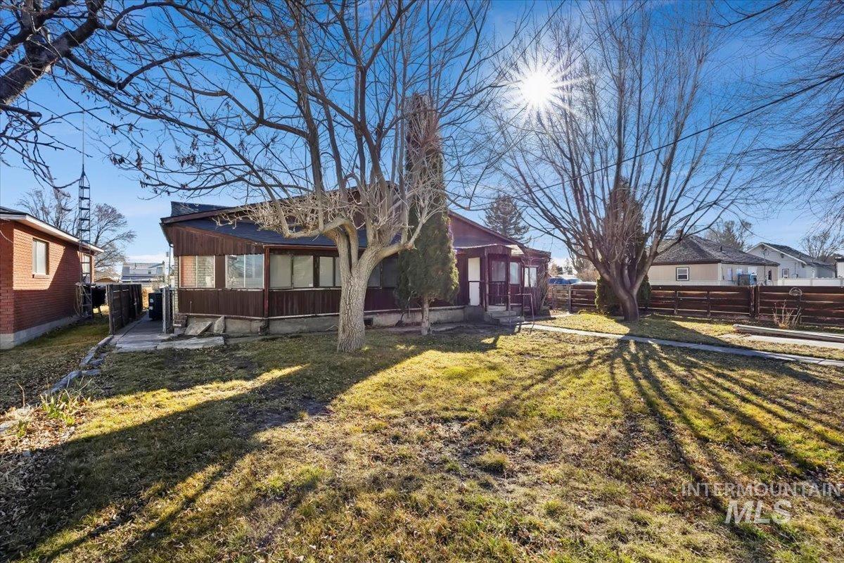 534 Miller Avenue Burley, ID 83318 - Photo 23 of 27 Rear view of house featuring a sunroom and a residential view