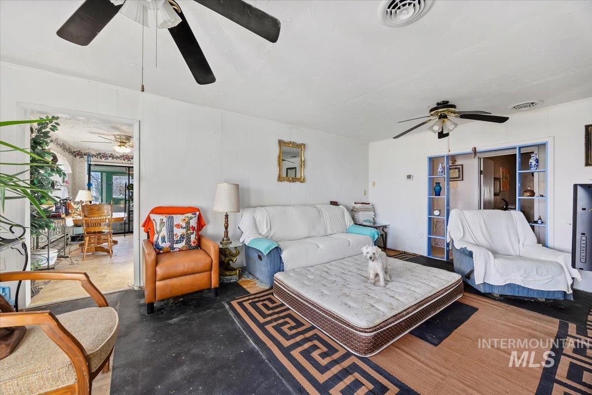 534 Miller Avenue Burley, ID 83318 - Photo 5 of 27 Living area with a ceiling fan and concrete floors