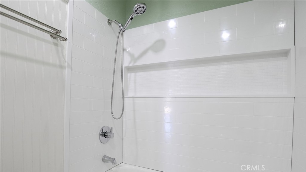 25885 Trabuco Road, Unit 235 Lake Forest, CA 92630 - Photo 14 of 16 a bathroom with a glass shower door