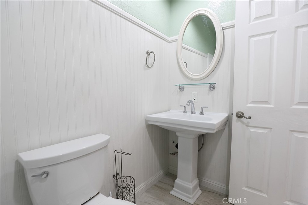 25885 Trabuco Road, Unit 235 Lake Forest, CA 92630 - Photo 15 of 16 a bathroom with a sink and a mirror