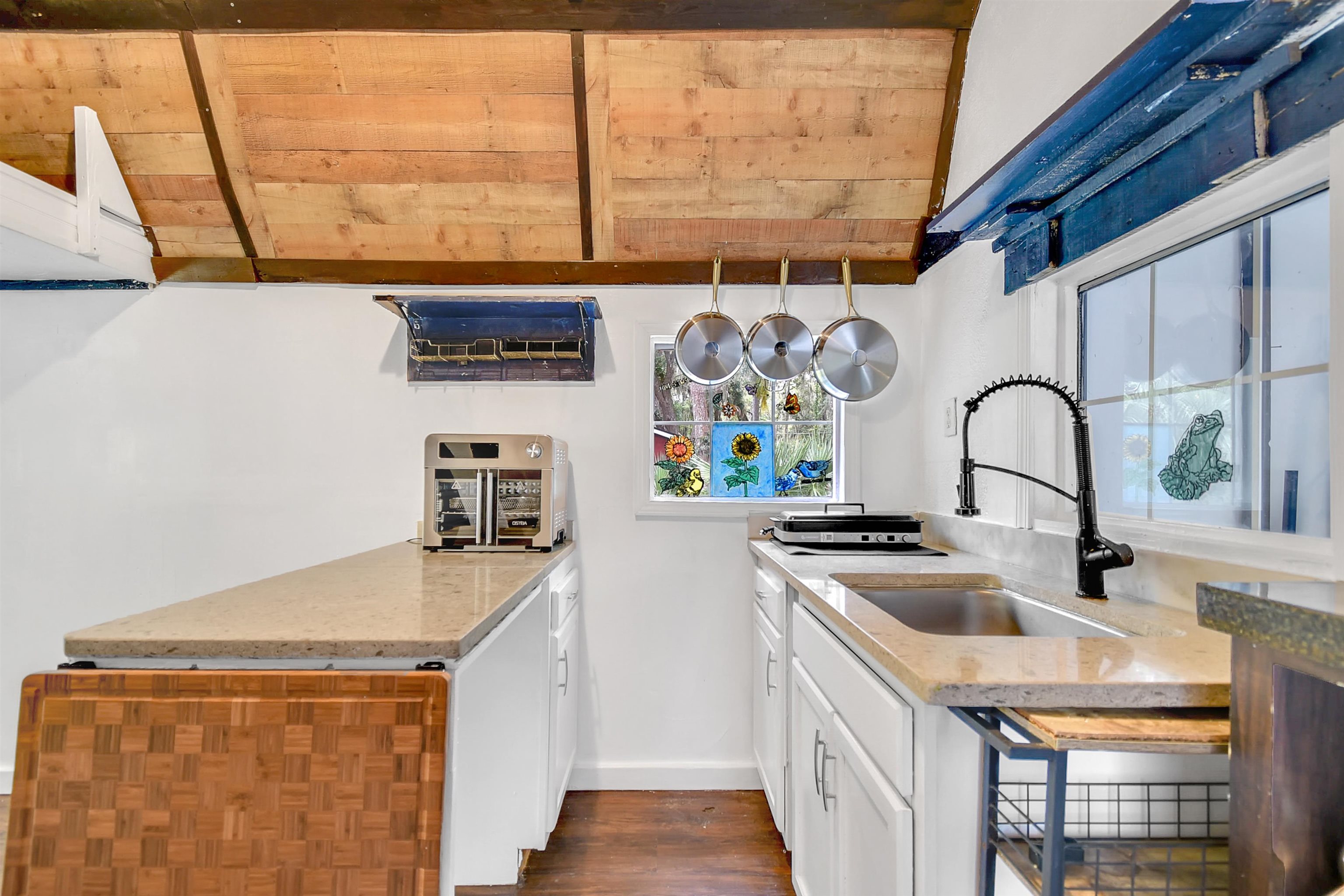 4895 Ave D, Unit B St. Augustine, FL 32095 - Photo 12 of 22 a kitchen with stainless steel appliances a sink a stove and a refrigerator