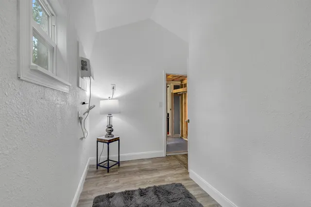a bathroom with a granite countertop sink a toilet and a mirror