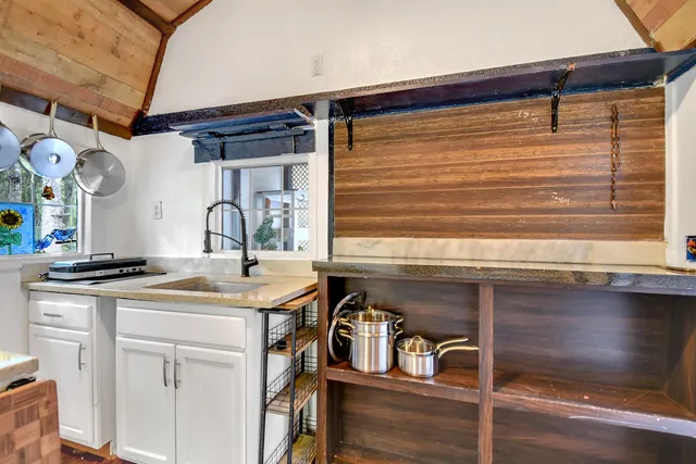 a kitchen with a sink and cabinets