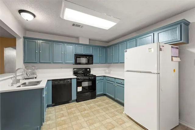 a kitchen with a stove and a microwave