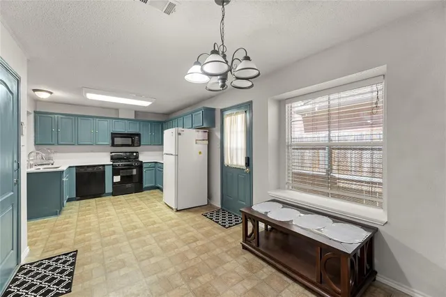 a spacious bathroom with a granite countertop sink a large mirror and a shower