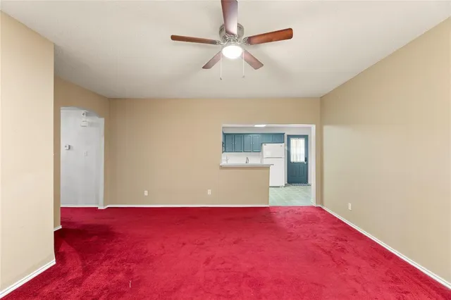 a view of a big room with windows