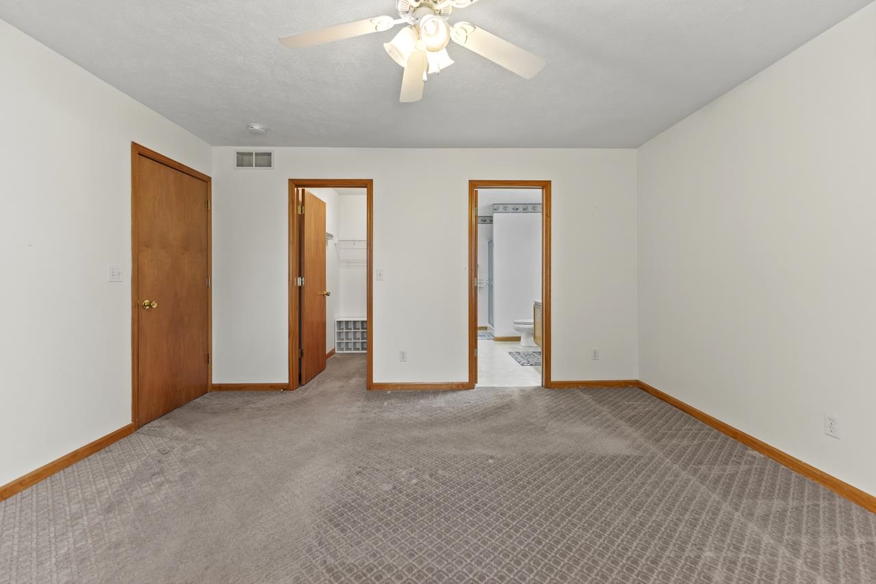 816 Lake Summerset Road Lake Summerset, IL 61019 - Photo 15 of 29 an empty room with windows and closet