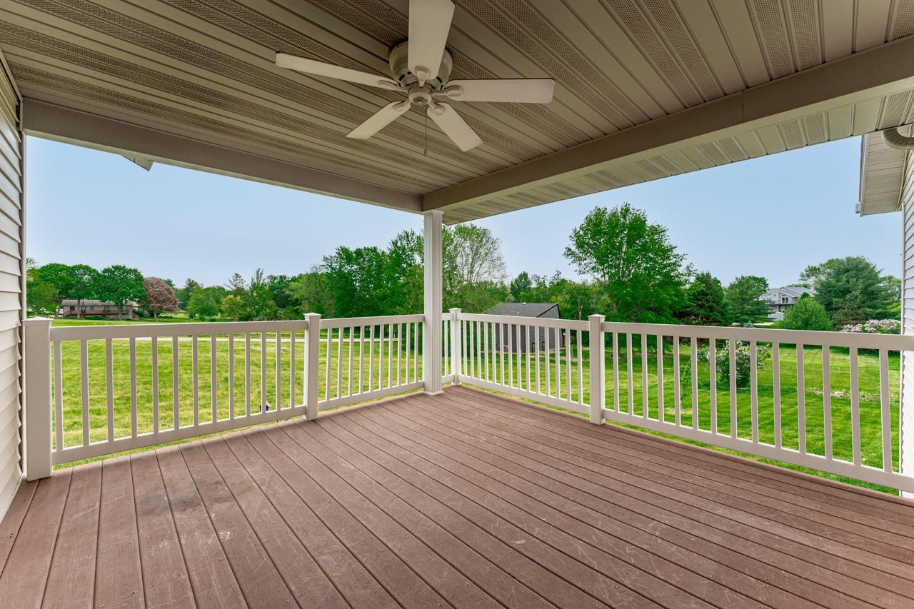 816 Lake Summerset Road Lake Summerset, IL 61019 - Photo 16 of 29 a view of a balcony with wooden floor and outdoor space