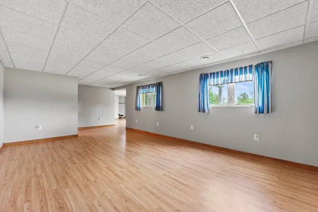 a view of a room with wooden walls