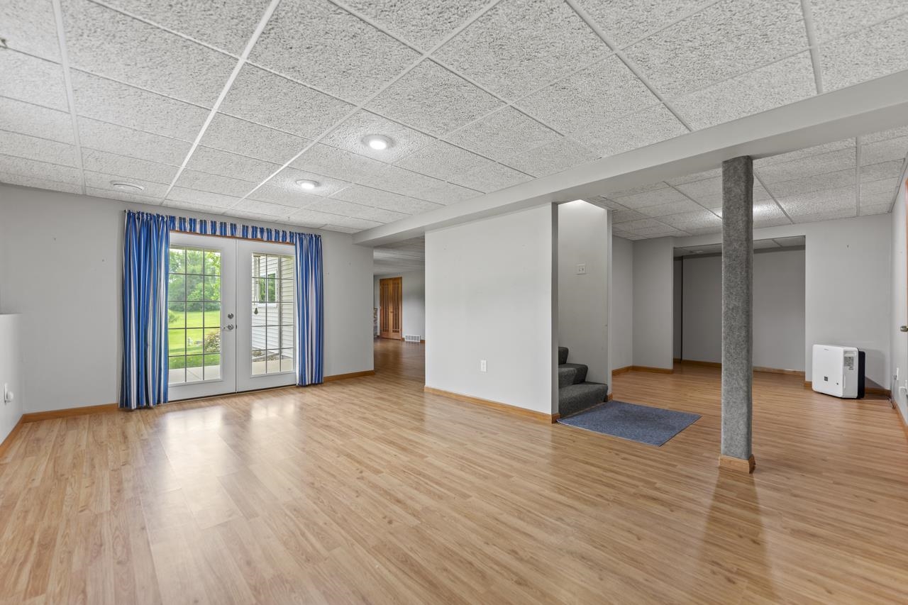816 Lake Summerset Road Lake Summerset, IL 61019 - Photo 23 of 29 a view of an empty room with wooden floor and a window