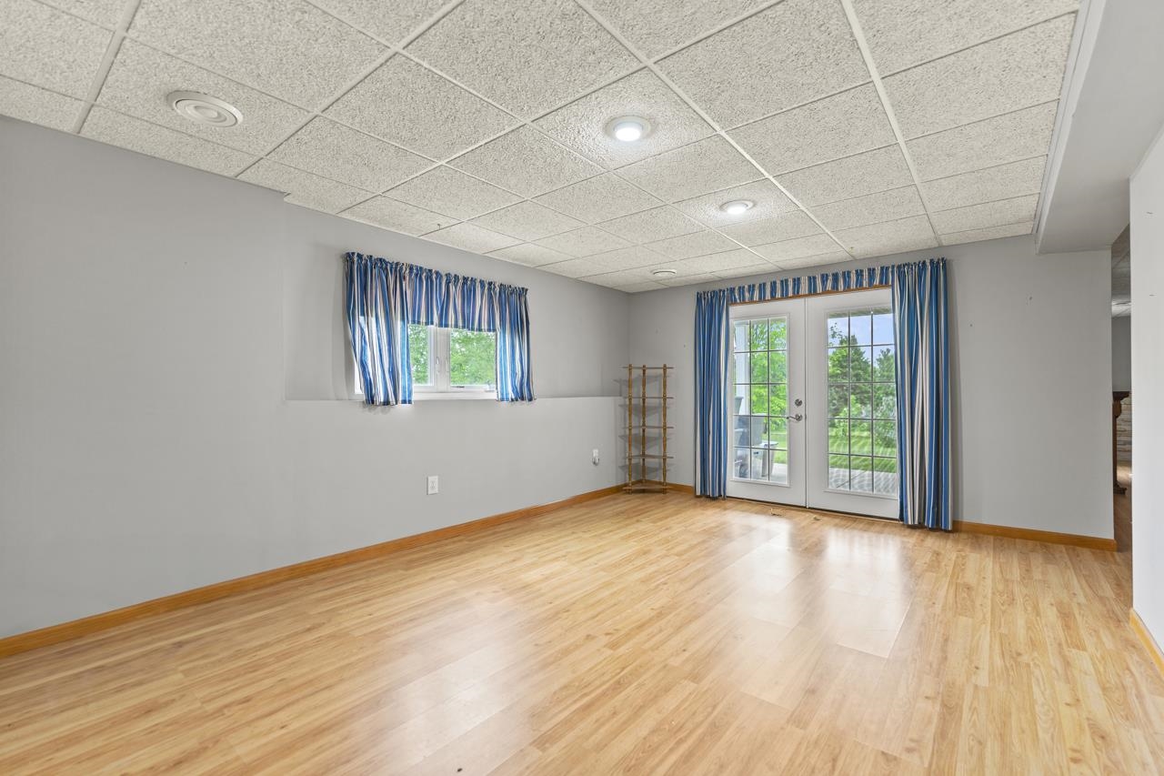 816 Lake Summerset Road Lake Summerset, IL 61019 - Photo 24 of 29 a view of an empty room with a window and wooden floor