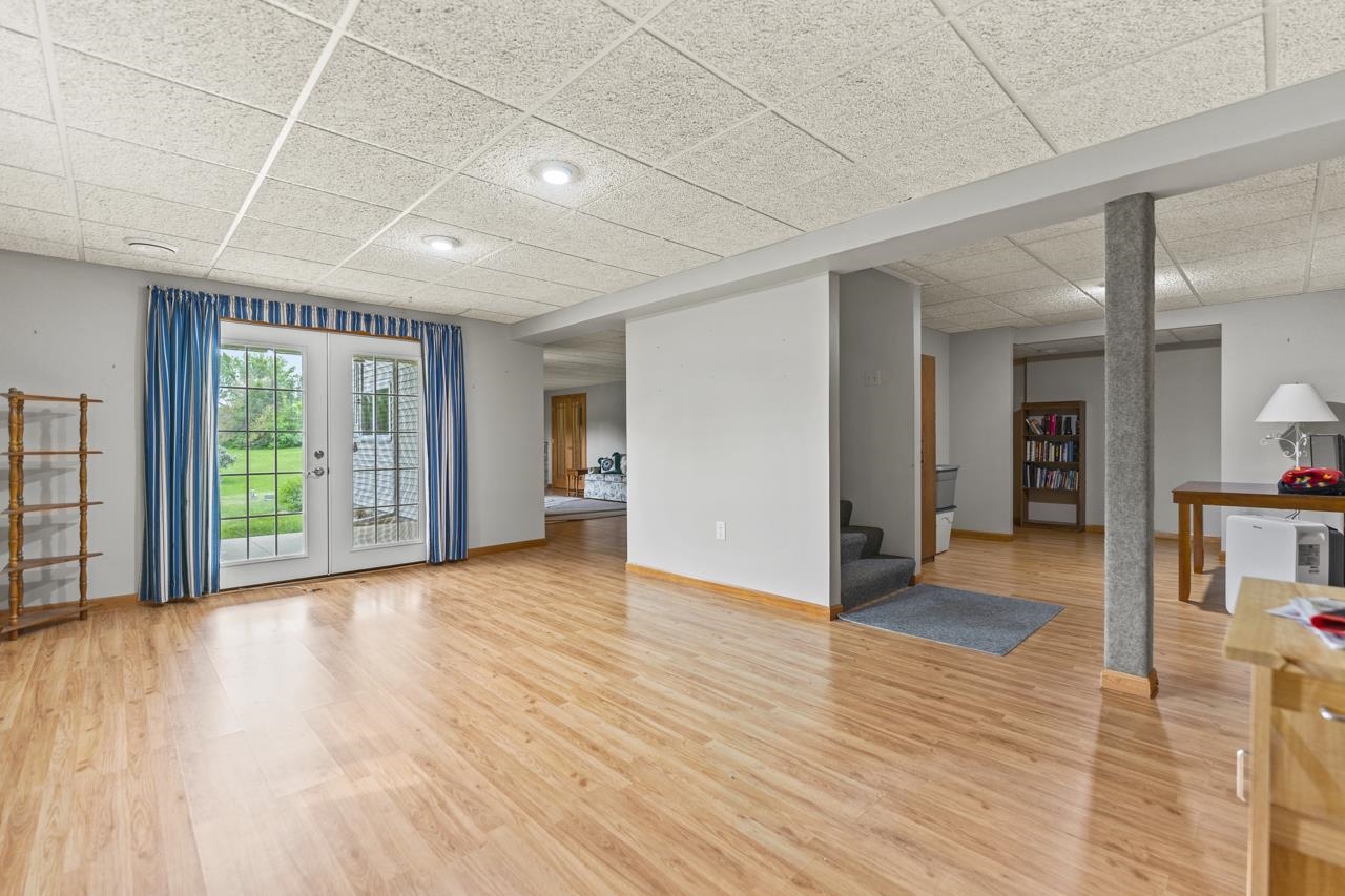 816 Lake Summerset Road Lake Summerset, IL 61019 - Photo 25 of 29 a view of an empty room with window and wooden floor
