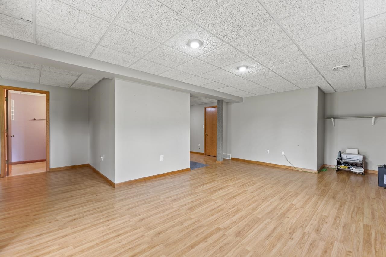 816 Lake Summerset Road Lake Summerset, IL 61019 - Photo 26 of 29 a view of an empty room with wooden floor