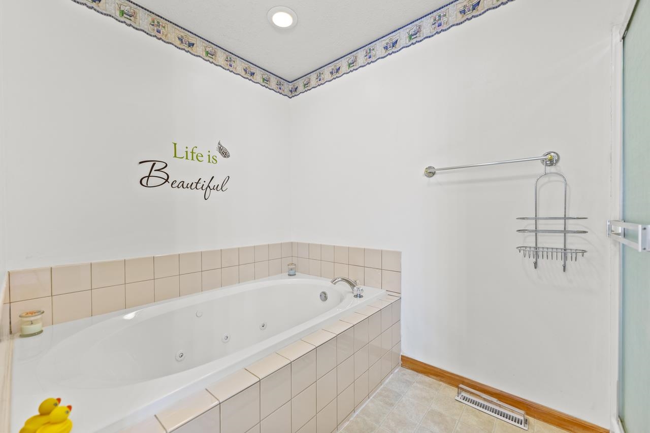 816 Lake Summerset Road Lake Summerset, IL 61019 - Photo 6 of 29 a bathroom with a bathtub and shower