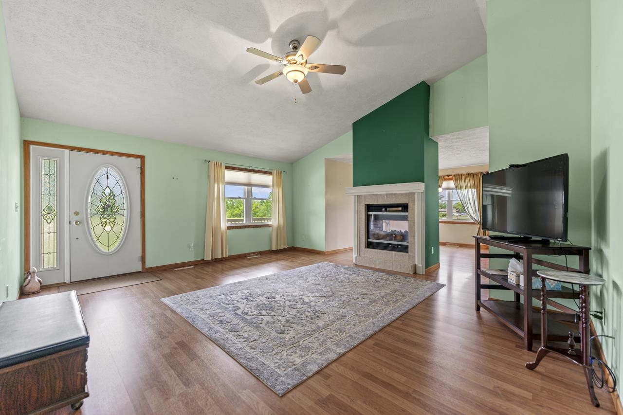 816 Lake Summerset Road Lake Summerset, IL 61019 - Photo 8 of 29 a living room with furniture and a flat screen tv