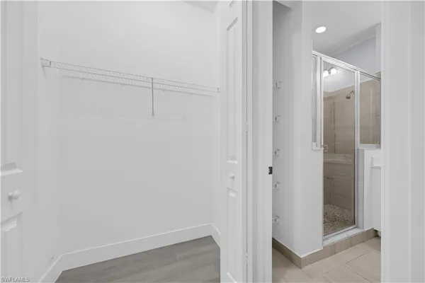 a bathroom with a double vanity sink toilet and a mirror