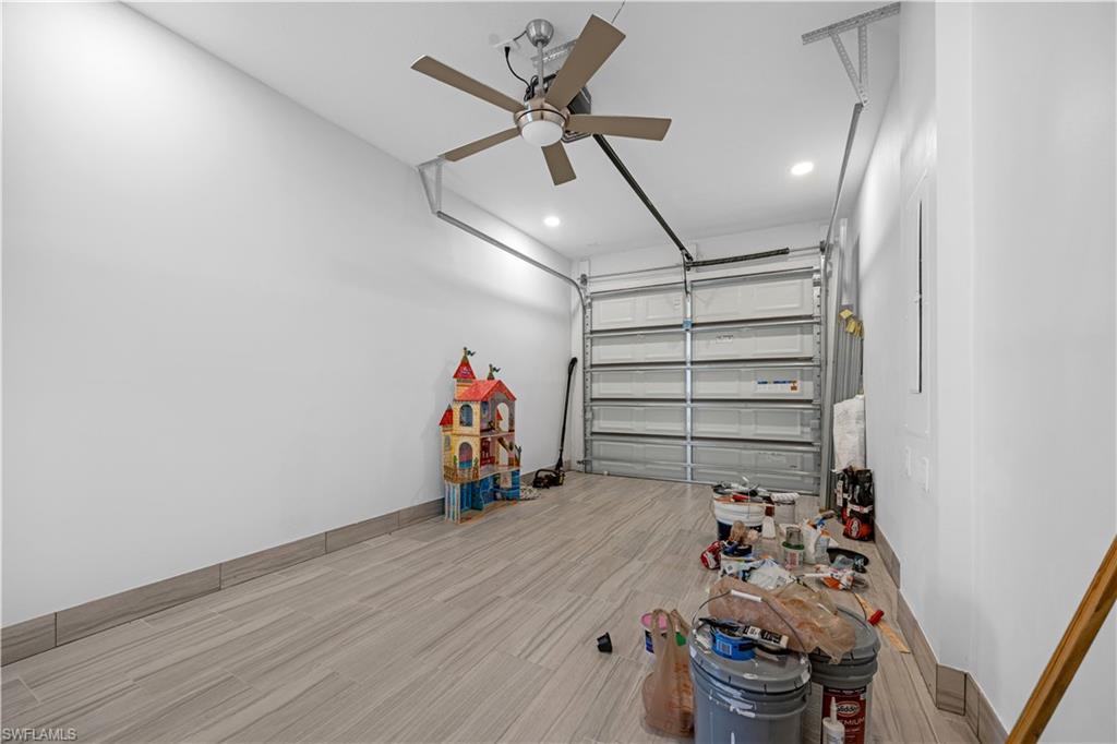 9045 Madrid Circle Naples, FL 34104 - Photo 42 of 46 a view of a storage room with racks on the wall