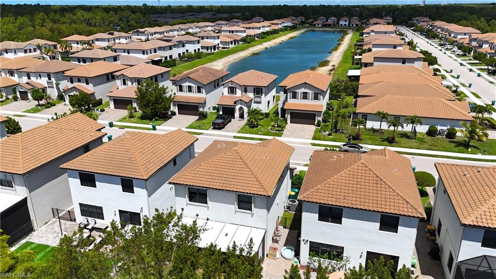 9045 Madrid Circle Naples, FL 34104 - Photo 43 of 46 an aerial view of residential houses and street