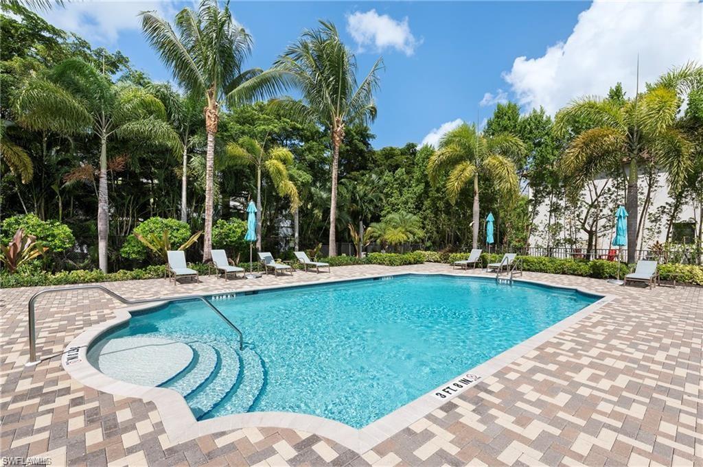 9045 Madrid Circle Naples, FL 34104 - Photo 45 of 46 a view of a swimming pool with a patio