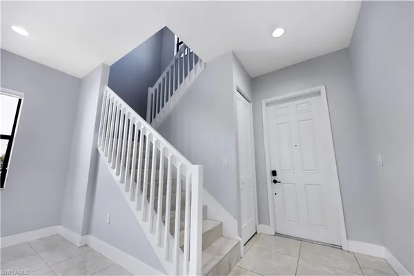 a view of a hallway with entryway and closet