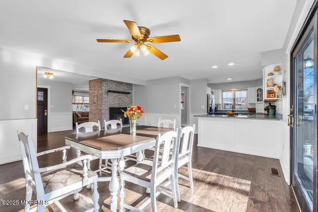 a kitchen that has a lot of cabinets and appliances