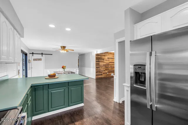 a bathroom with a sink a toilet and shower curtain