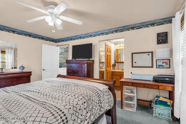 a bedroom with furniture and a book shelf