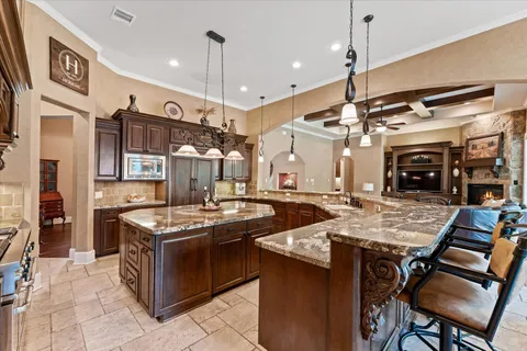 a kitchen with stainless steel appliances granite countertop a stove and a sink