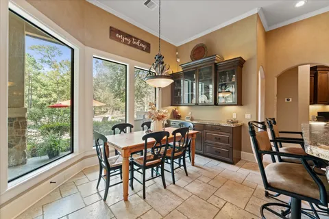 a kitchen with a refrigerator and a stove top oven