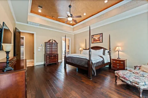 a large spacious bathroom with a granite countertop sink a mirror and shower