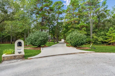 a view of a street with a yard