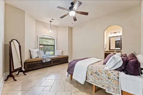 a bathroom with a granite countertop sink a mirror and a shower