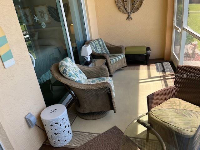 2060 Matecumbe Key Road, Unit 2104 Punta Gorda, FL 33955 - Photo 7 of 44 a living room with furniture and a mirror