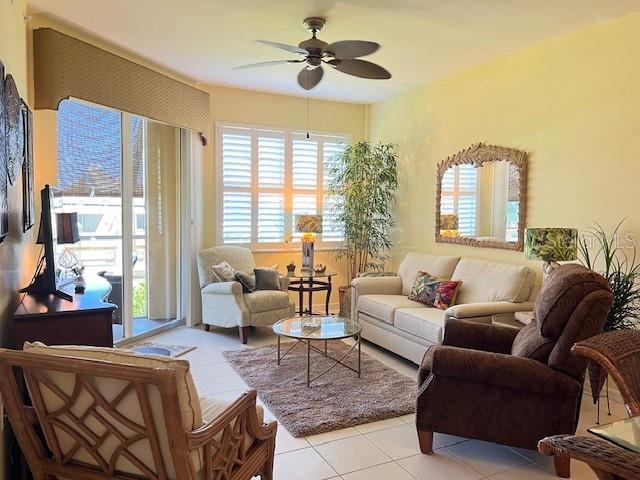 2060 Matecumbe Key Road, Unit 2104 Punta Gorda, FL 33955 - Photo 10 of 44 a living room with furniture and a large window